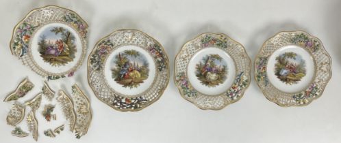 A Dresden part dessert service, with a pierced border, the centres decorated with figures (qty) some