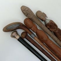 A late 19th/early 20th century novelty walking stick, in the form of a golf club, 90 cm, and five