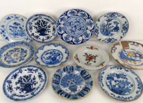 A Delft blue and white plate, 23 cm wide, and assorted other Delft plates (11) All with either