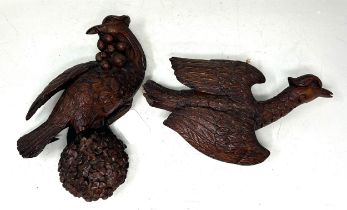 A pair of late 19th century carved wood figures, of birds, 22 cm high, and 13 cm high (2)