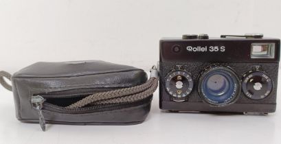 A Rollei 35S camera, with carrying case Appears to have been dropped at some point, due to a dent