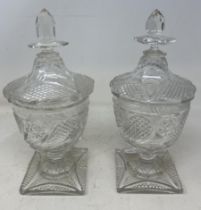 A pair of 18th century style cut glass vases and covers, 27 cm high