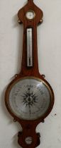 A Victorian wheel barometer, by J Hughes, London, with silvered dials, in a rosewood case, 114 cm