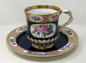 A late 19th century Meissen porcelain cup and a matching plate, with floral deocration on a blue