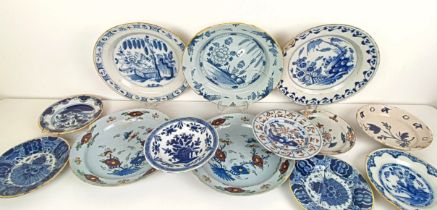 A Delft blue and white plate, 35 cm diameter, and assorted other Delft plates (12) All with losses