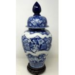 A Japanese blue and white vase and cover, on a stand, 38 cm high