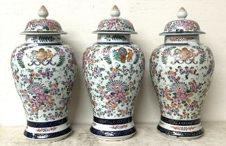 A Sampson 'Chinese Armorial' garniture of three vases, and covers, 40 cm high (3)