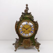 A Louis XV style mantel clock, the 13.5 cm diameter gilt metal dial with enamel numerals, fitted