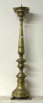 A large 18th century style brass floor standing pricket stick, on lion paw feet, 96 cm high Drip pan