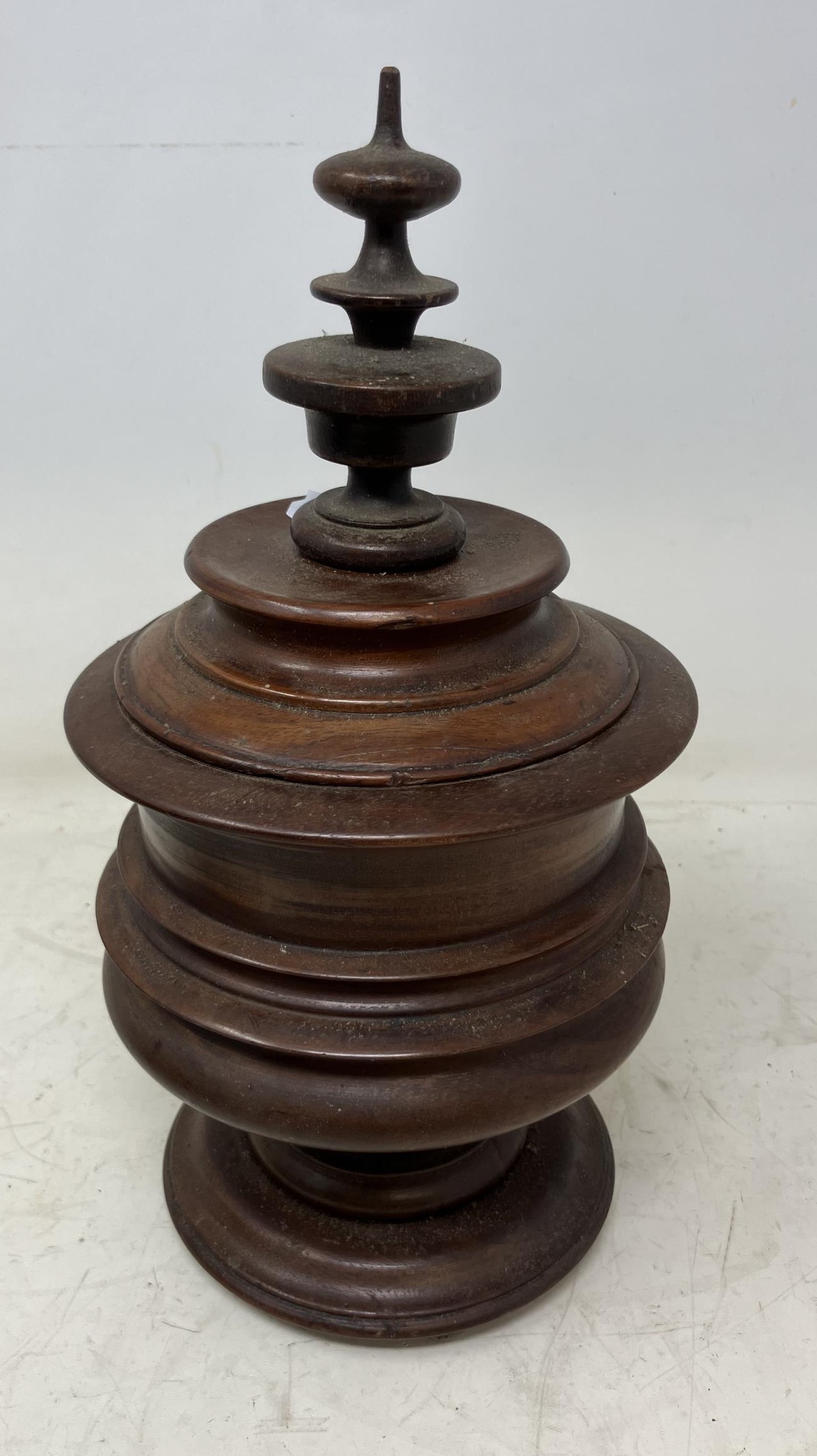 A Dutch treen tobacco box, and a small leather covered travelling vanity case, with silver