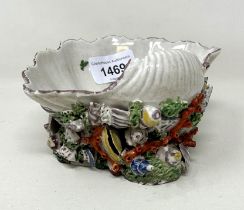 A mid-18th century Plymouth Porcelain shell salt, with enamel colours, 15.5 cm wide General chips