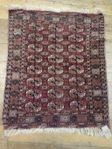An antique Turkamon rug, 120 x 102 cm
