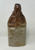 A 19th century stoneware novelty bottle, 8.5 cm high