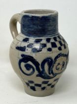 An 18th century German Westerwald stoneware jug, with GR cypher, 15 cm high