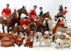 A Beswick huntsman, another, assorted Beswick horses, Beswick hounds and other Beswick items (qty)