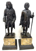 A 19th century bronze figure, of a gentleman holding a cane, on a marble base, 23 cm high, and its