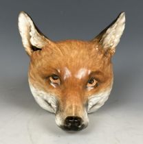 A large 19th century porcelain fox head stirrup cup, probably Worcester or Derby, 17 cm high