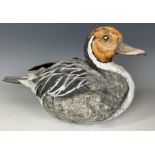 A pottery figure of a duck, 30 cm wide, and a carved and painted figure of a duck, 51 cm wide (2)