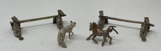 A pair of novelty silver plated knife rests, in the form of greyhounds, a brooch in the form of a