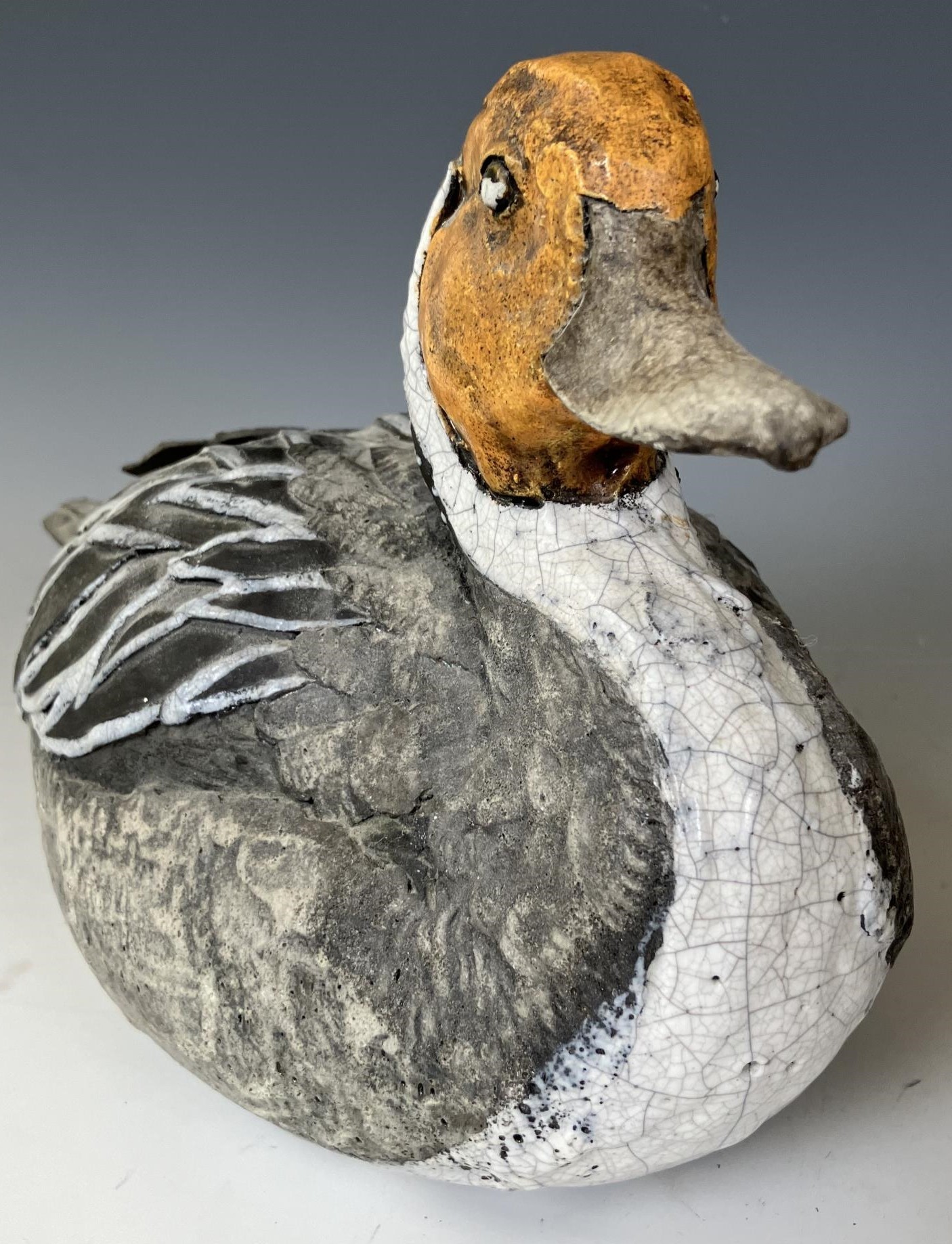 A pottery figure of a duck, 30 cm wide, and a carved and painted figure of a duck, 51 cm wide (2) - Image 2 of 4