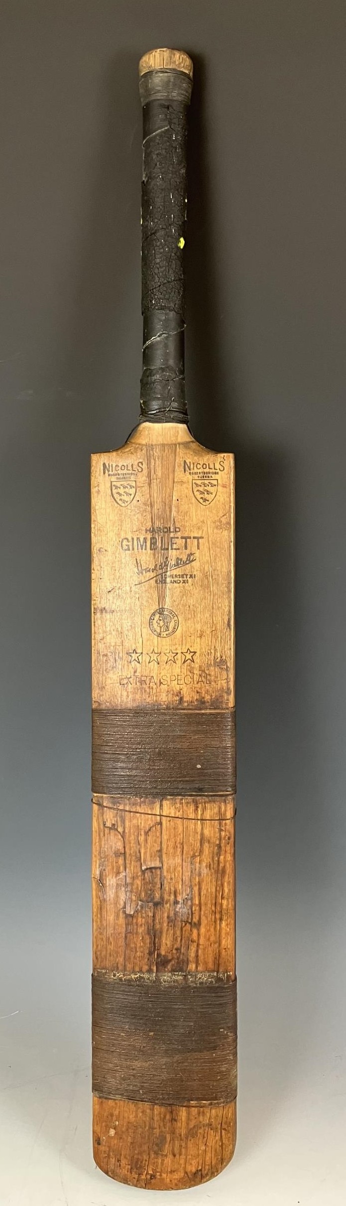 A vintage Gimblett cricket bat, a set of pads, a leather cricket bag, two blazers and assorted other