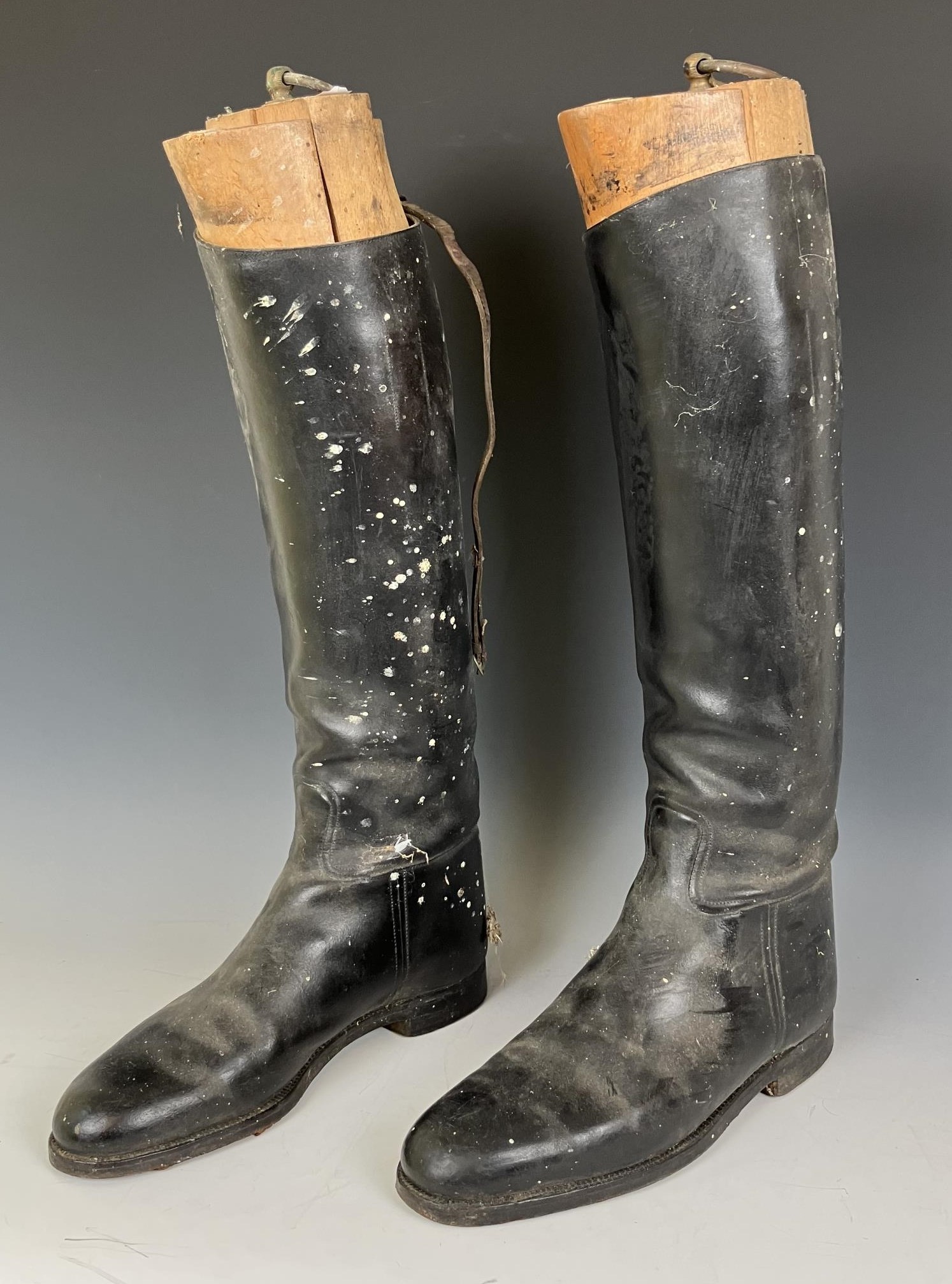 A pair of vintage leather riding boots, with trees, and three Snaffles hunting prints, Hogany