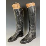 A pair of vintage leather riding boots, with trees, and three Snaffles hunting prints, Hogany