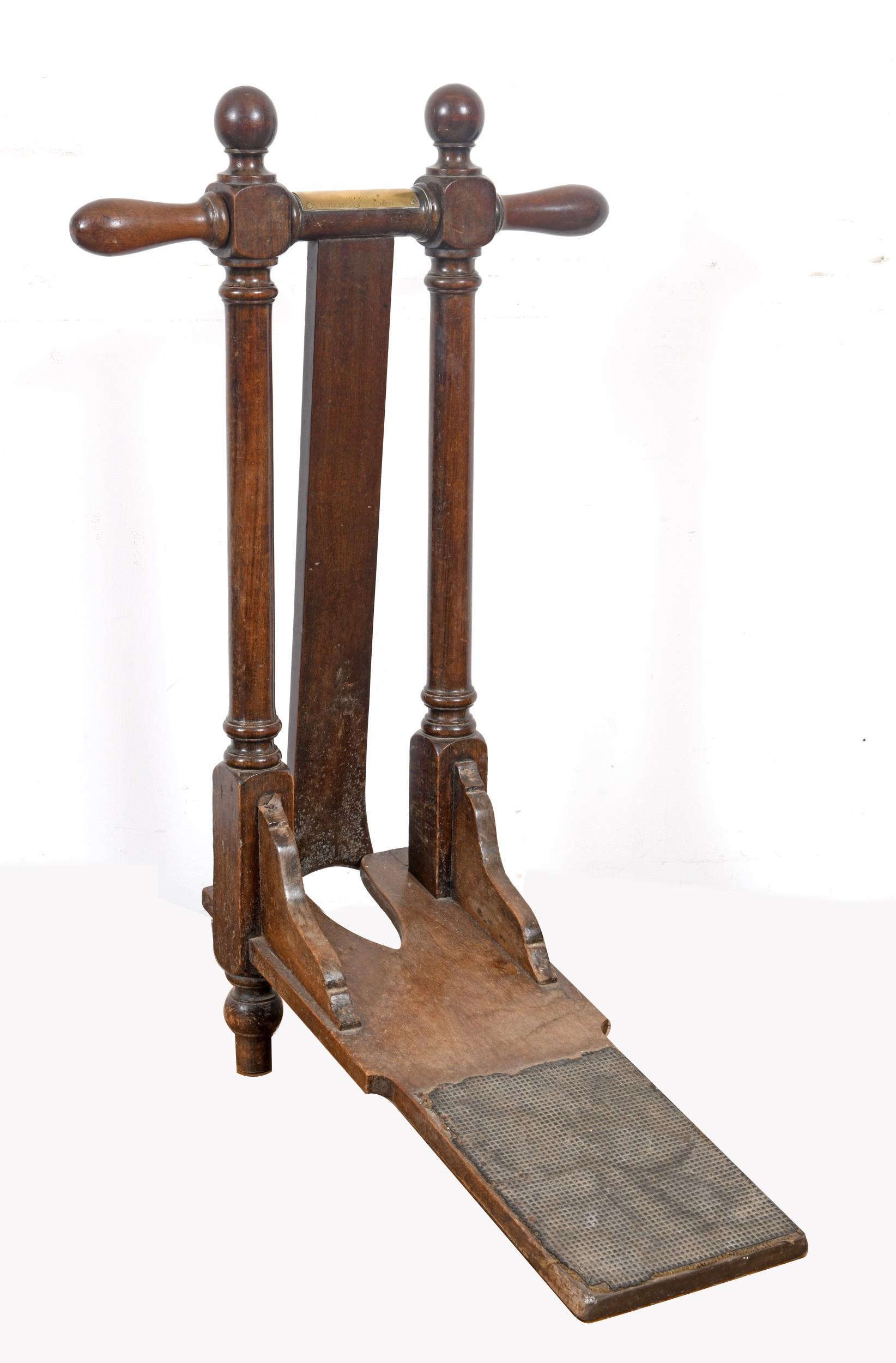 A 19th century mahogany boot pull, the brass plaque reading Maxwell Dover St London, 97 cm high