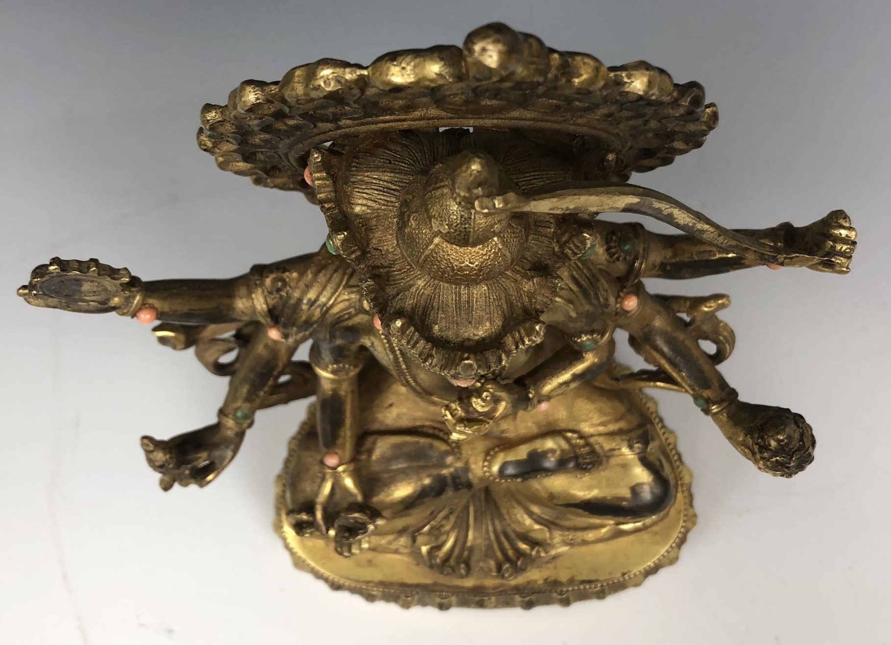 An Indian deity figure, set with green and peach stones, 25 cm high - Image 2 of 4