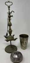 A Persian beaker, 13 cm high, a silver coloured metal box and cover, 9 cm diameter, and a brass