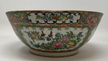 A Cantonese famille rose bowl, decorated figures and foliage, 27.5 cm diameter Rim rubbed, star