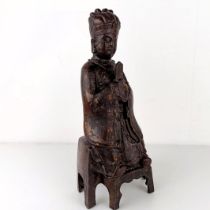 A Chinese Ming style iron buddha holding a sceptre, with splashed decoration, seal mark with six