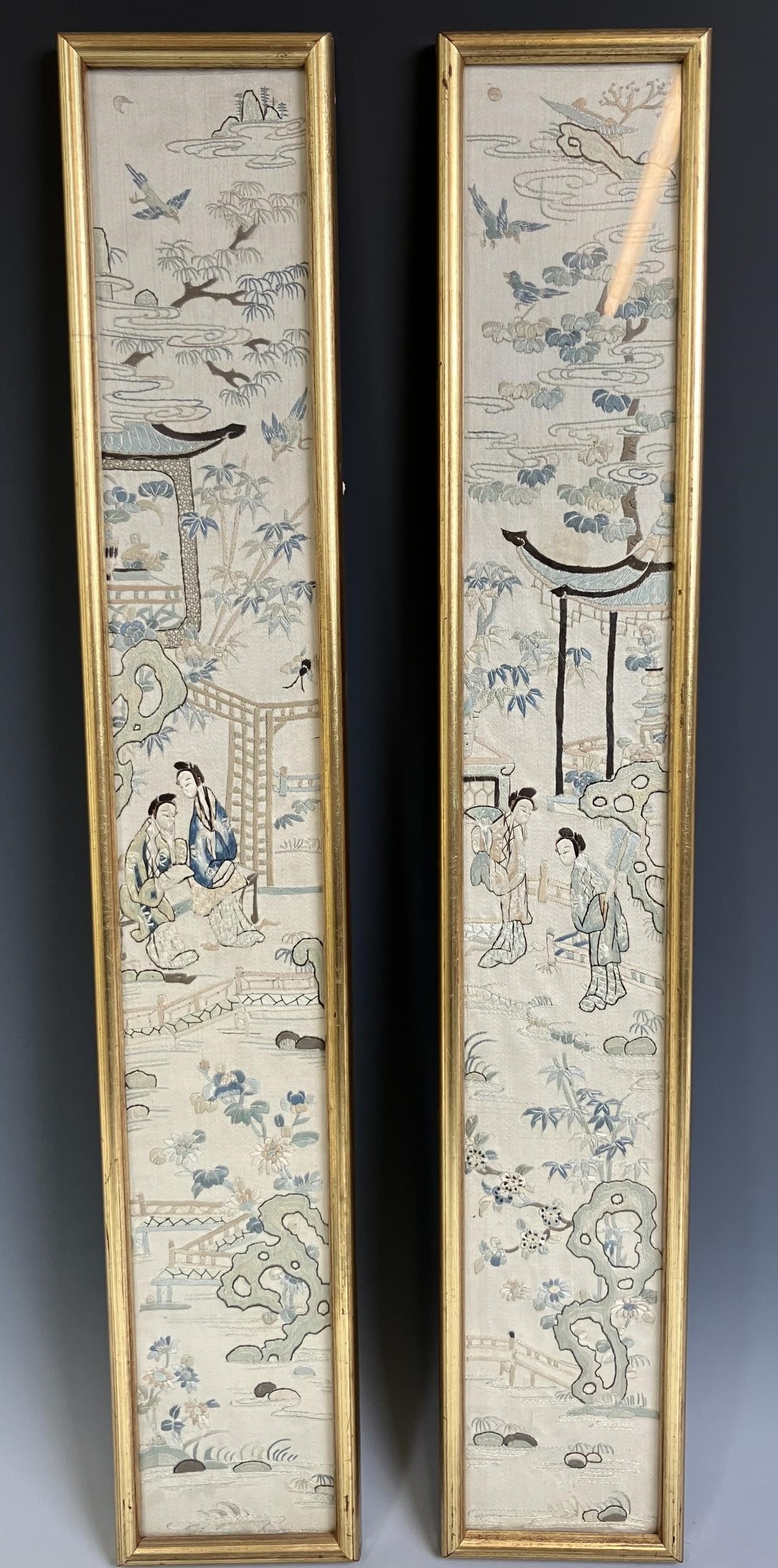 A pair of Chinese silk embroidered panels, decorated figures, 55 x 7 cm, and another similar, 48 x 9