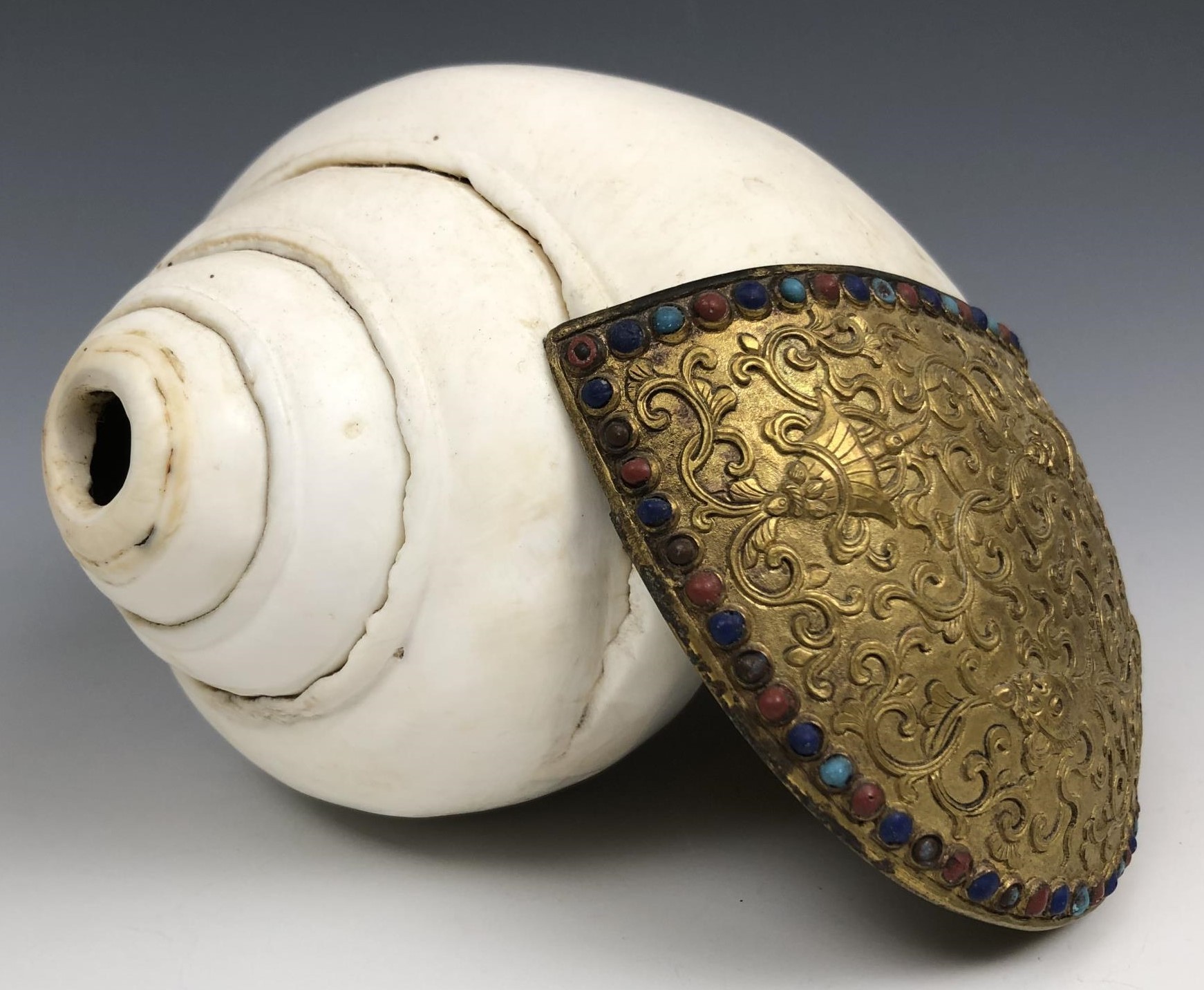 A Chinese conch shell trumpet, with a gilt bronze flange decorated in relief, with the eight - Image 2 of 6