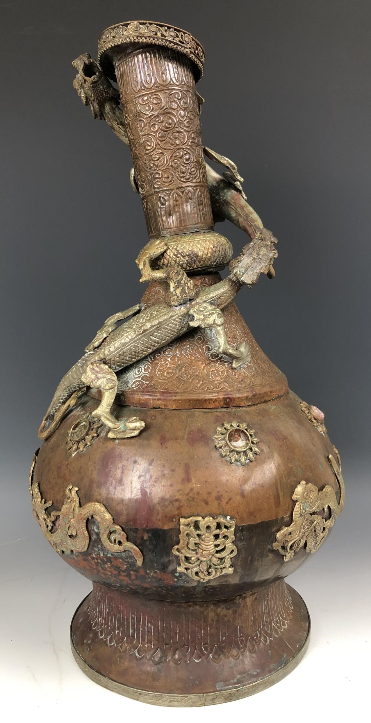 An Eastern brass oil lamp, 60 cm wide, and a brass and copper vase, decorated dragons, 49 cm high - Image 2 of 13