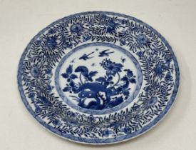 A Chinese porcelain shallow dish, decorated birds and foliage in underglaze blue, 27.5 cm diameter