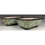 A pair of Chinese Canton enamel jardinieres, decorated flowers on a pale green ground, 19.5 cm