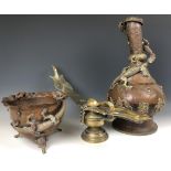 An Eastern brass oil lamp, 60 cm wide, and a brass and copper vase, decorated dragons, 49 cm high