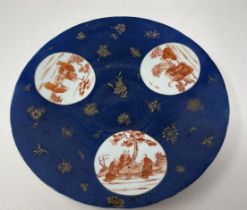 A Chinese powder blue charger, with three roundels, decorated figures, 33 cm diameter No visible