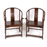 A pair of Chinese hardwood chairs, the backs carved with bat and fish (2) Overall condition good