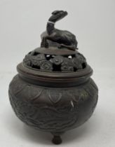 A Japanese bronze koro and cover, with a dragon finial, 17 cm high