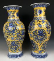 A matched pair of Chinese yellow ground vases, six character marks to the bases, 47 cm and 48 cm (2)