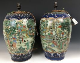 A large pair of Chinese vases, of lobed ovoid form, decorated figures in enamel colours, drilled and
