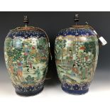 A large pair of Chinese vases, of lobed ovoid form, decorated figures in enamel colours, drilled and