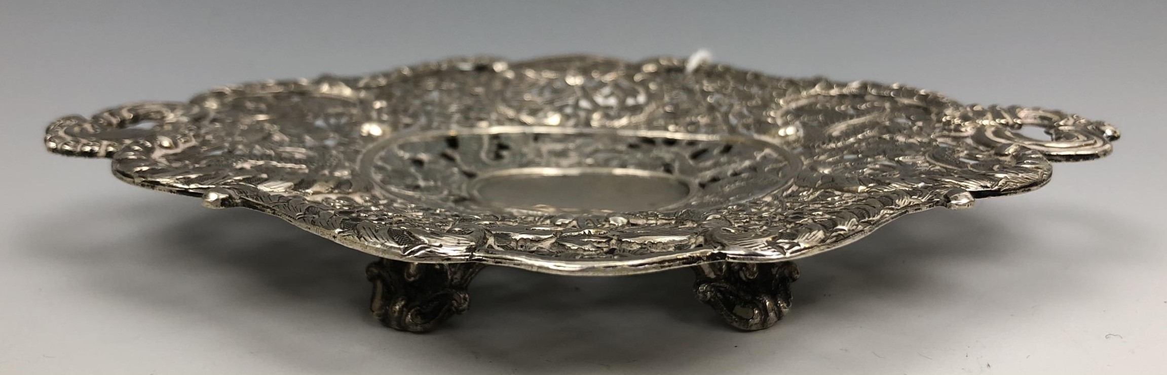 A Chinese silver coloured metal dish, embossed and pierced prunus and dragons, 15.5 cm wide 3.1 ozt - Image 2 of 4
