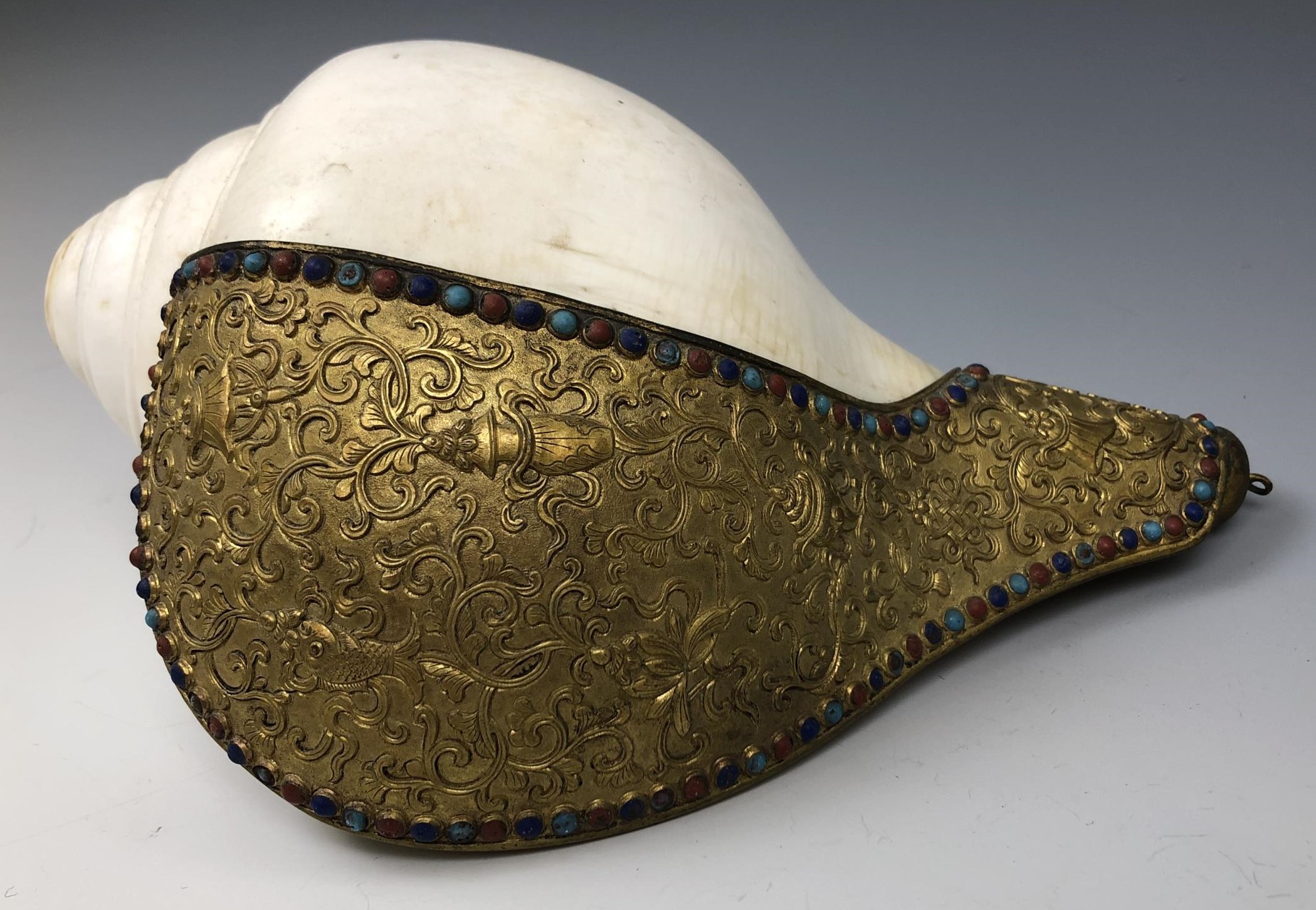 A Chinese conch shell trumpet, with a gilt bronze flange decorated in relief, with the eight - Image 3 of 6