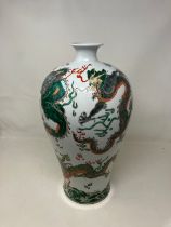 A Chinese famille verte vase, decorated dragons chasing flaming pearl, six character mark to base,