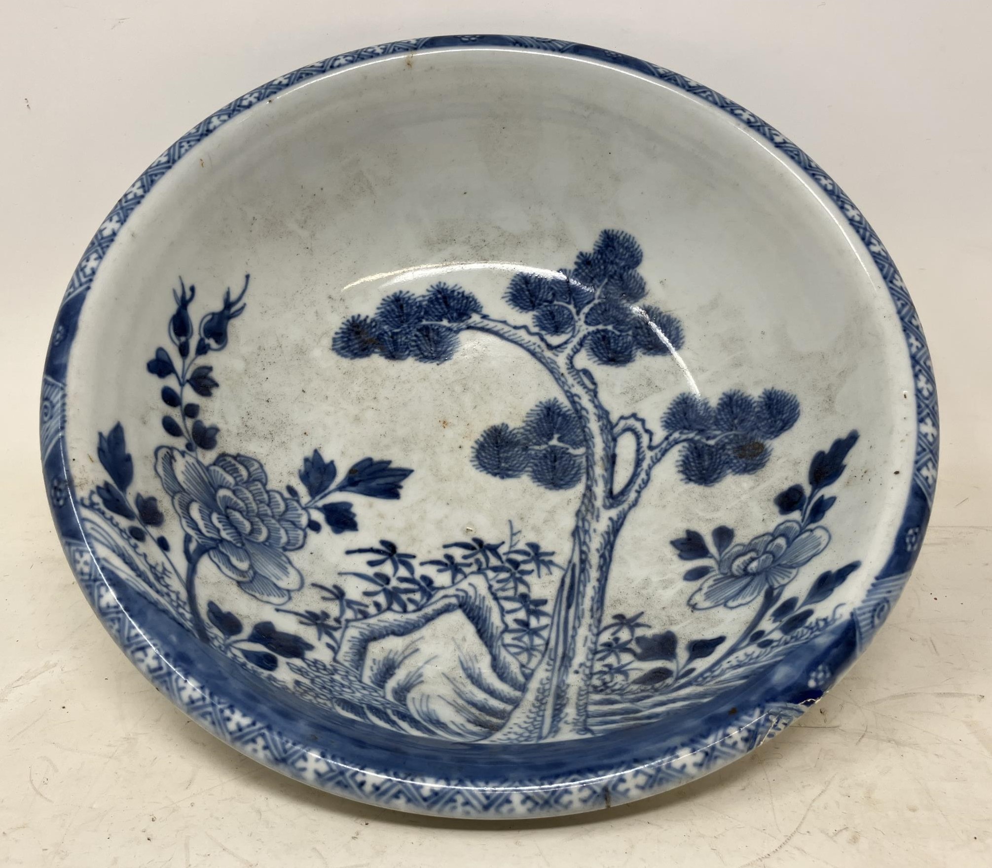 A Japanese pottery bowl, decorated foliage in underglaze blue, possibly 17th century, 27.5 cm