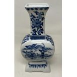 A Chinese blue and white vase, decorated figures, four character mark to base, 23 cm high