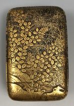 A Japanese lacquered box and cover, decorated flowers and foliage, 5 cm wide